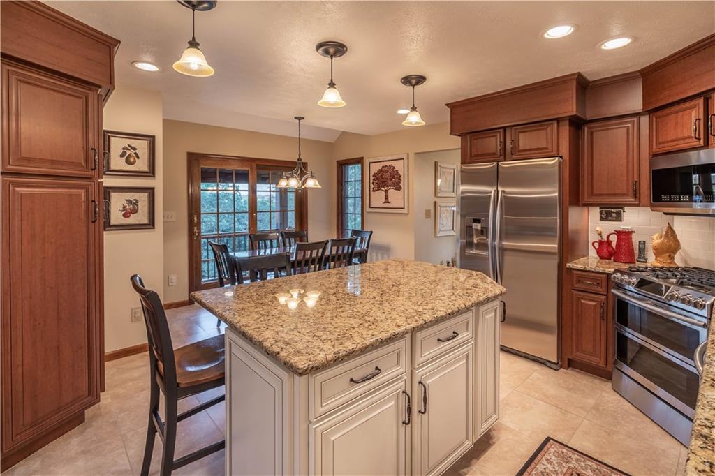 106 Roundtable Drive McMurray, PA 15317 - Photo 7 of 25 a kitchen with stainless steel appliances granite countertop a stove and a refrigerator