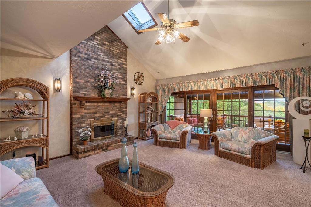 106 Roundtable Drive McMurray, PA 15317 - Photo 10 of 25 a living room with fireplace furniture and a floor to ceiling window