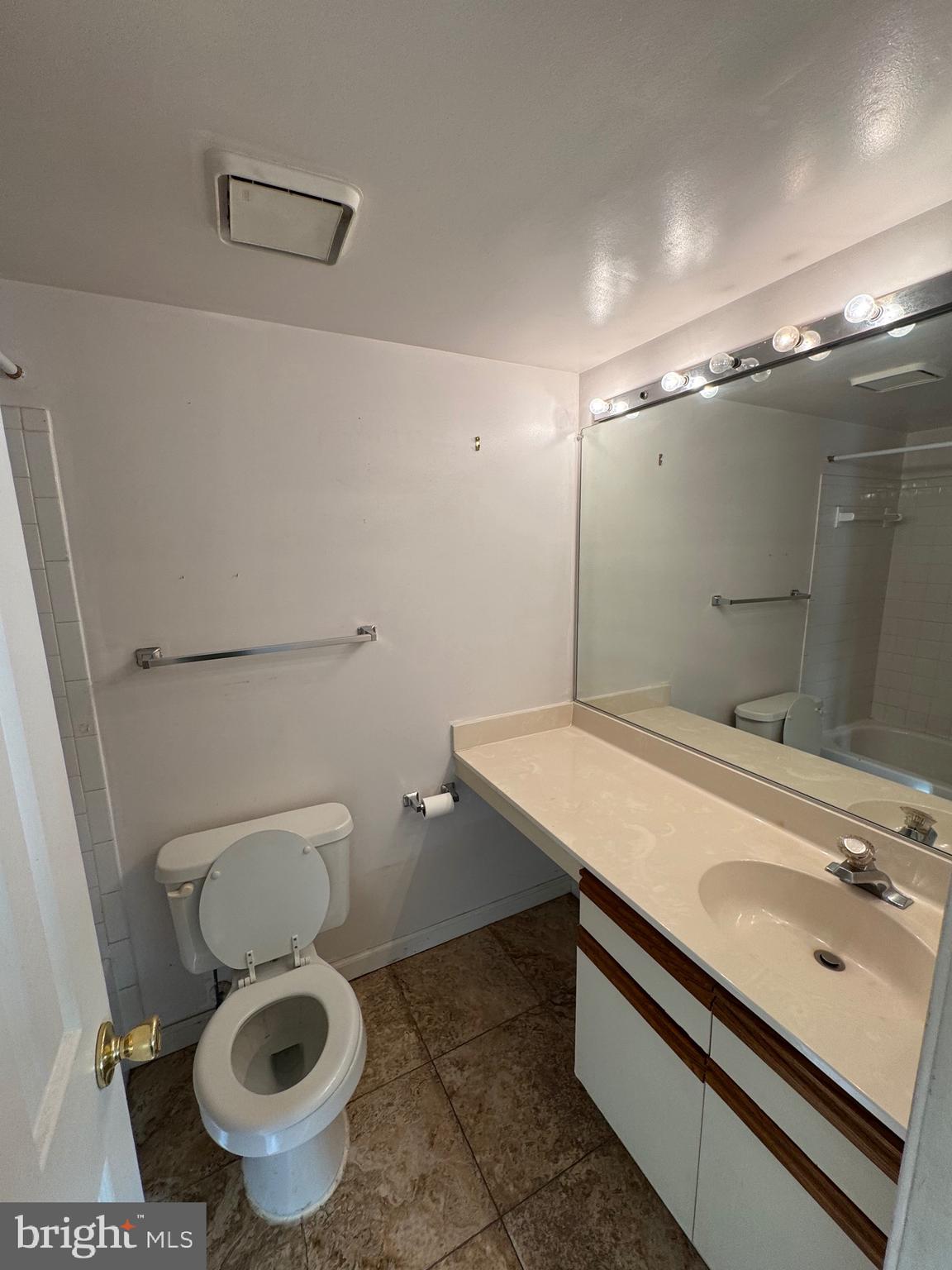 14121 Bowsprit Lane, Unit 301 Laurel, MD 20707 - Photo 6 of 8 a bathroom with a sink and a toilet
