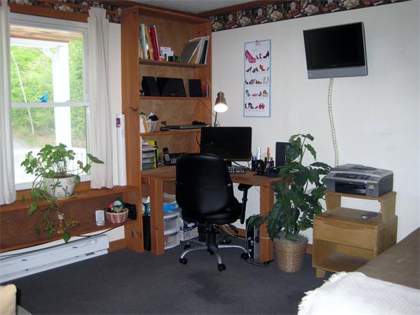 34 Kruse Road Hubbardston, MA 01452 - Photo 15 of 27 a view of a workspace with furniture and a flat screen tv