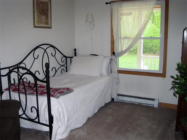 34 Kruse Road Hubbardston, MA 01452 - Photo 16 of 27 a bedroom with a bed and a window