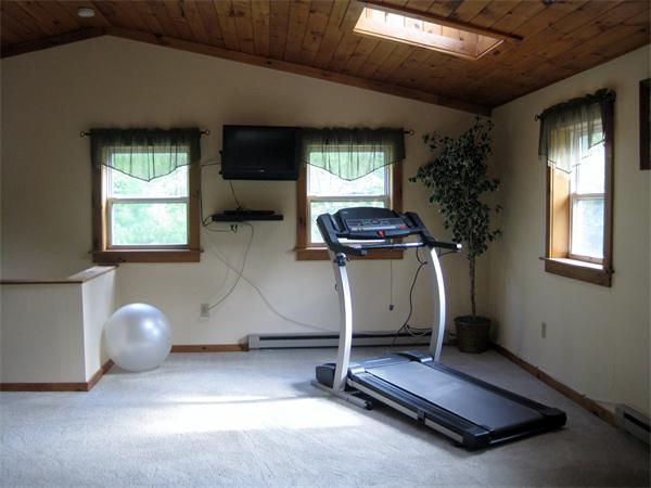 34 Kruse Road Hubbardston, MA 01452 - Photo 22 of 27 a room with gym equipment and a window