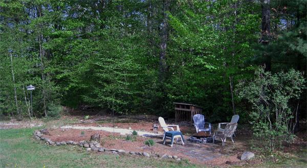 34 Kruse Road Hubbardston, MA 01452 - Photo 5 of 27 a view of backyard with outdoor seating and green space