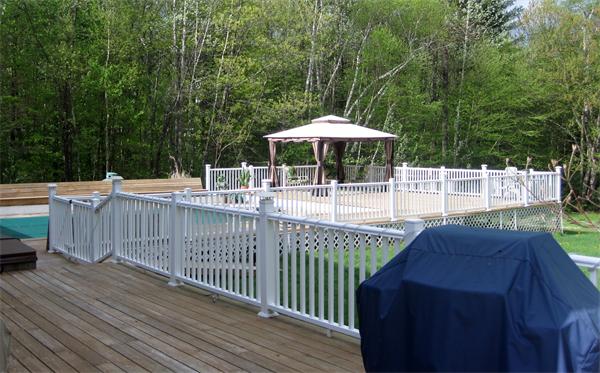 34 Kruse Road Hubbardston, MA 01452 - Photo 6 of 27 a view of a dinning table and chairs in patio with wooden fence