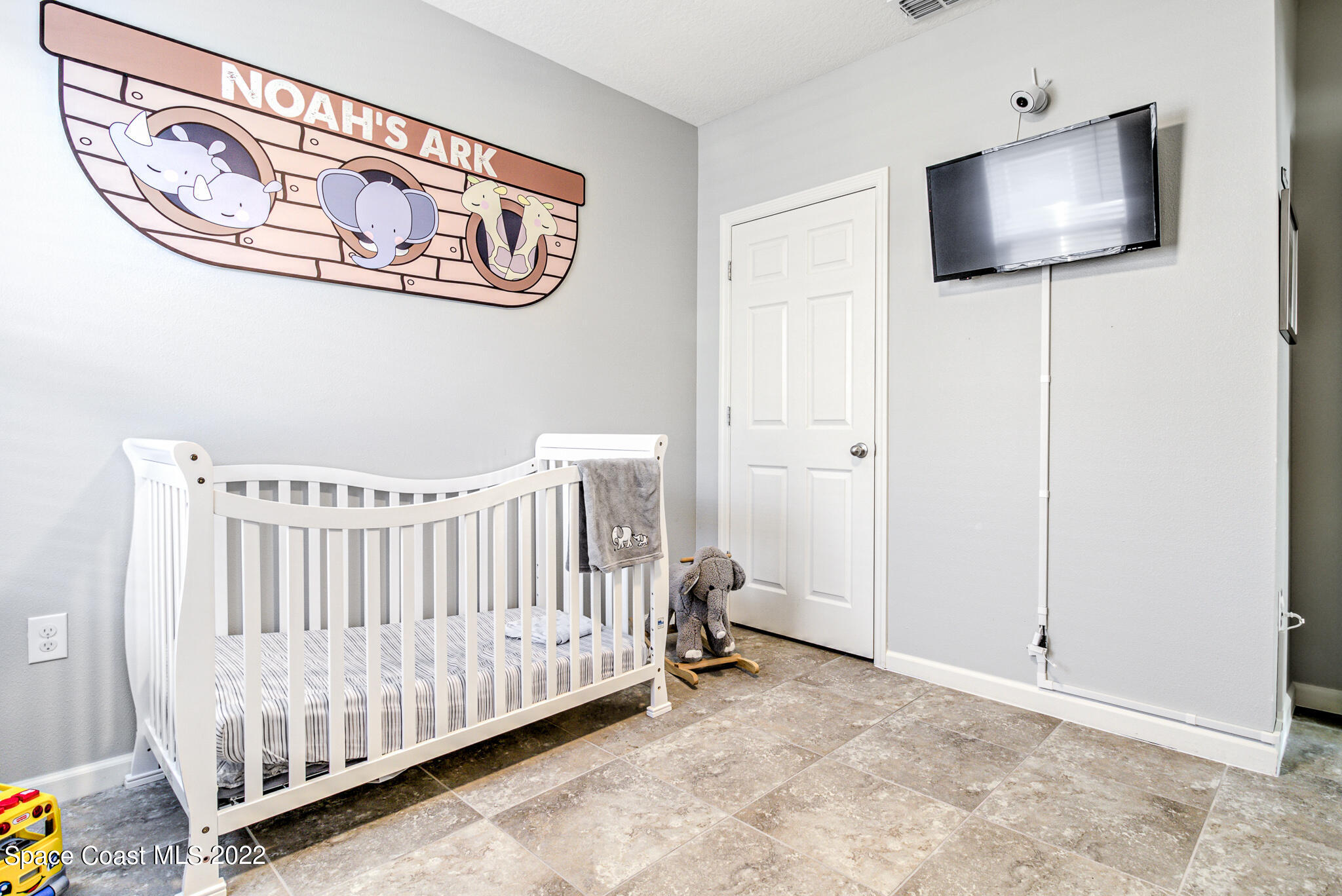 975 Newton Circle Rockledge, FL 32955 - Photo 19 of 30 a view of a livingroom with a flat screen tv