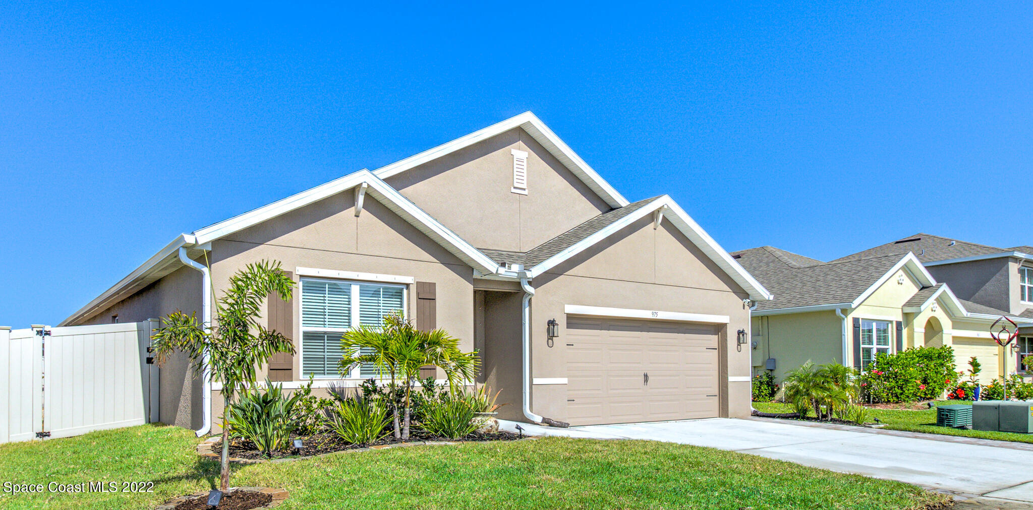 975 Newton Circle Rockledge, FL 32955 - Photo 2 of 30 a view of a house with a yard and plants