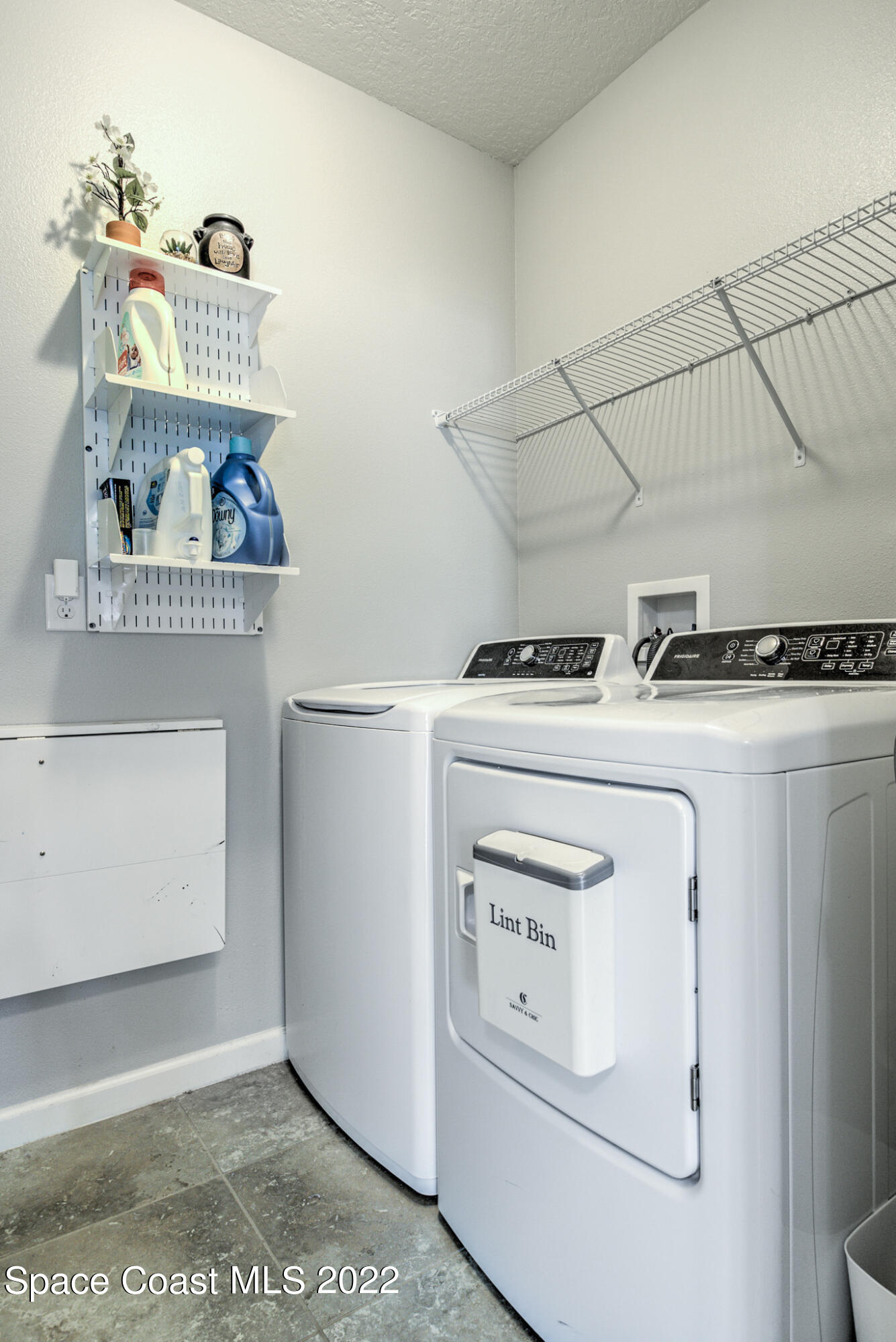 975 Newton Circle Rockledge, FL 32955 - Photo 23 of 30 a utility room with dryer and washer