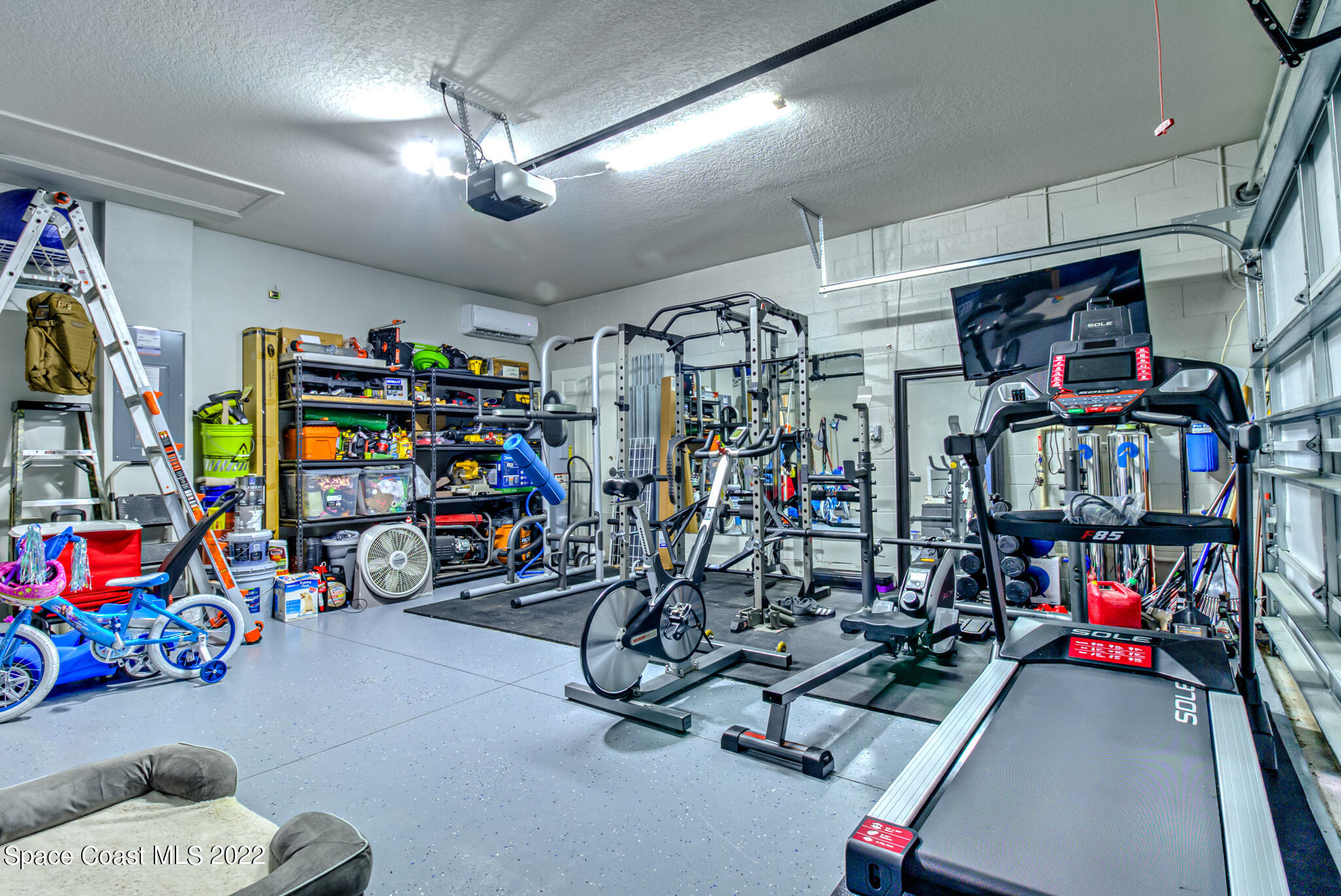 975 Newton Circle Rockledge, FL 32955 - Photo 25 of 30 a view of a garage with a lot of stuff