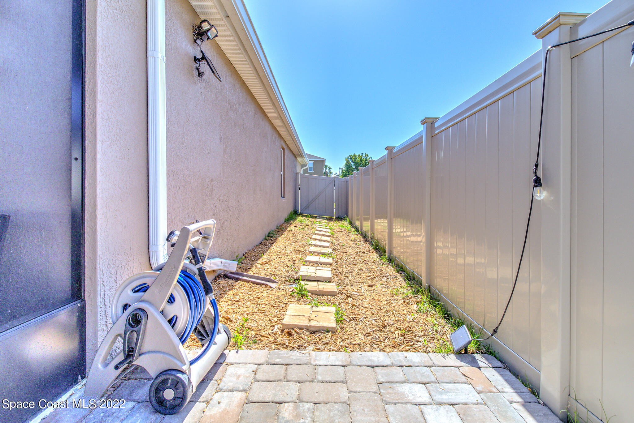 975 Newton Circle Rockledge, FL 32955 - Photo 27 of 30 a view of water heater room with wooden floor