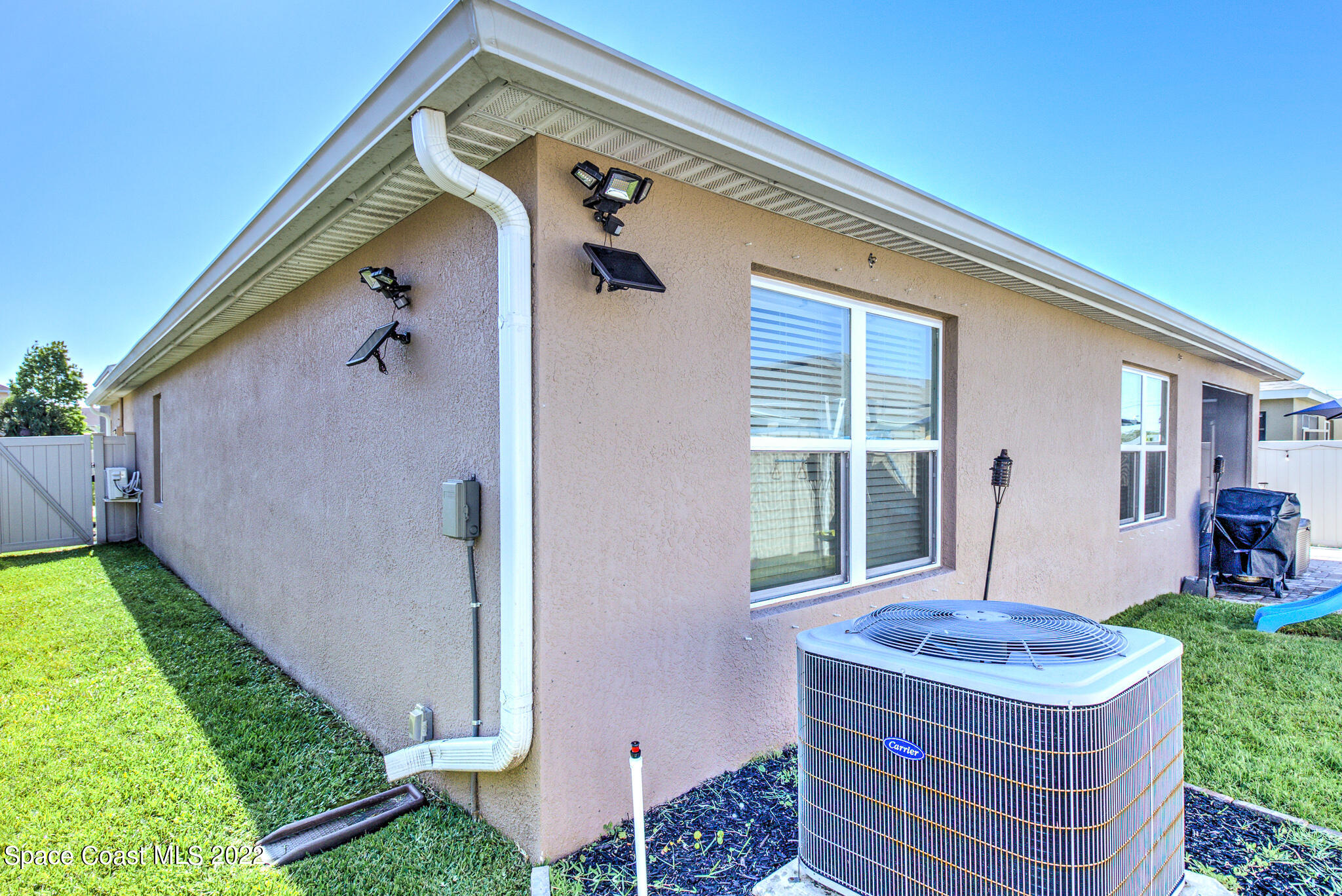975 Newton Circle Rockledge, FL 32955 - Photo 30 of 30 a front view of a house with garden