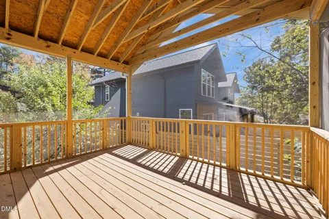 a view of balcony with wooden floor