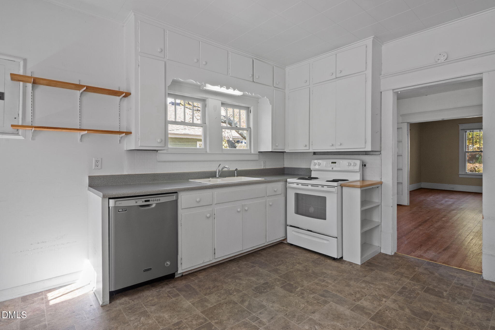 303 Clark Street Durham, NC 27701 - Photo 15 of 30 a white kitchen with a stove top oven