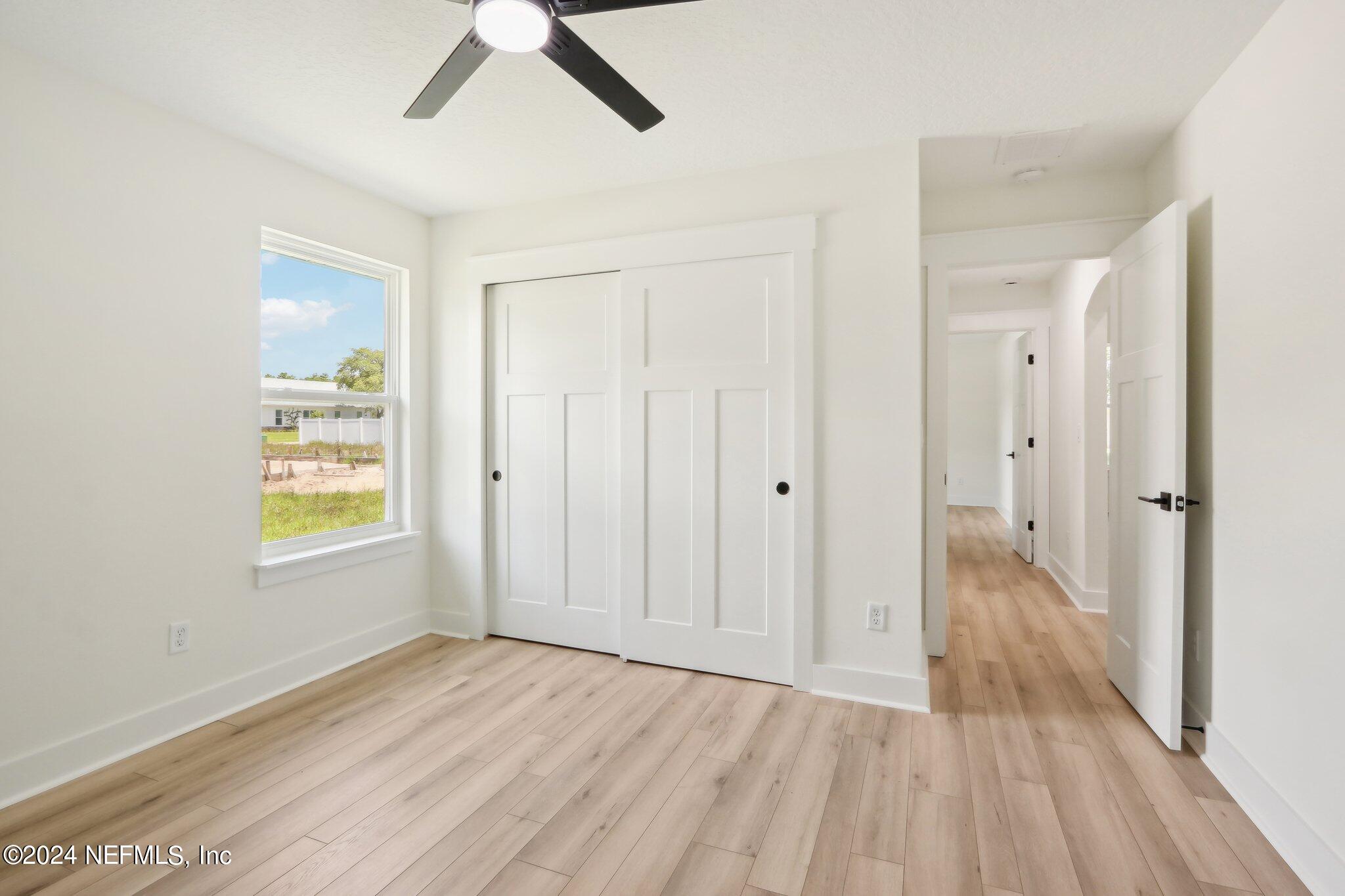 156 Cacique Drive St. Augustine, FL 32086 - Photo 26 of 68 a view of livingroom with hardwood floor and window