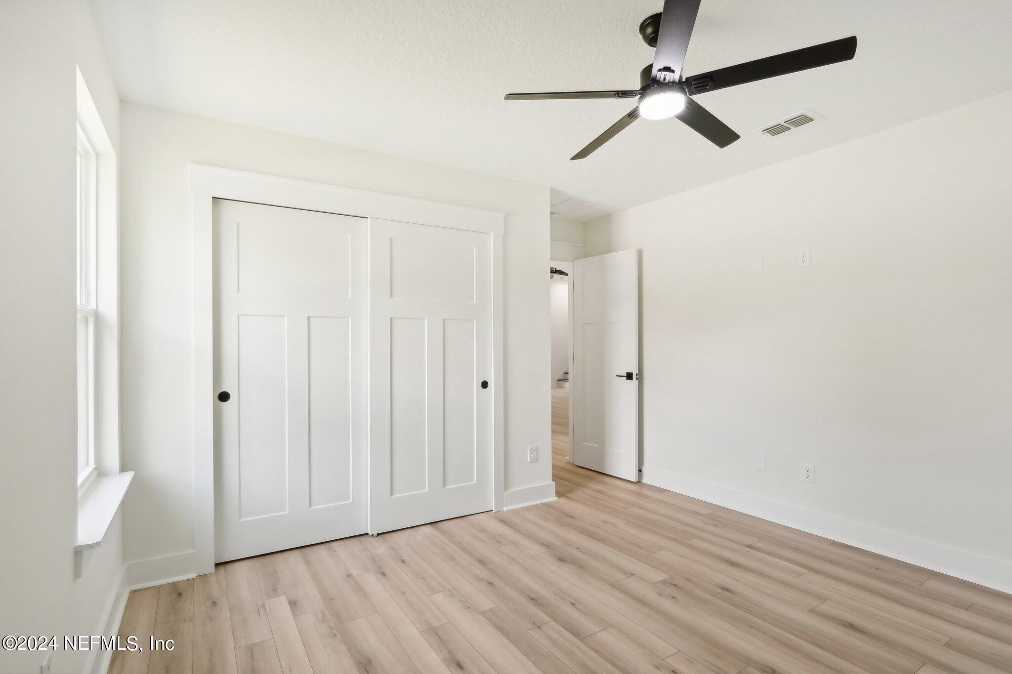 156 Cacique Drive St. Augustine, FL 32086 - Photo 27 of 68 wooden floor in an empty room