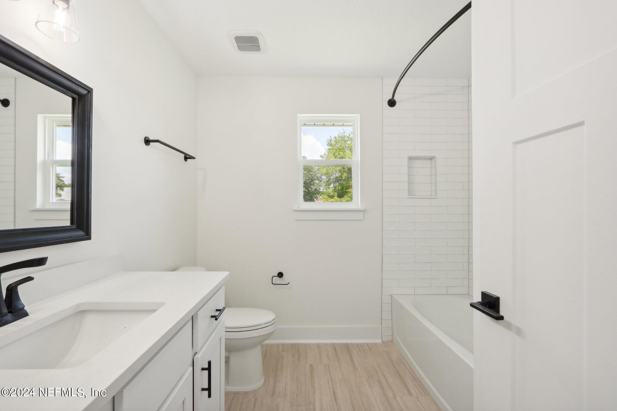 156 Cacique Drive St. Augustine, FL 32086 - Photo 28 of 68 a bathroom with a sink toilet and shower