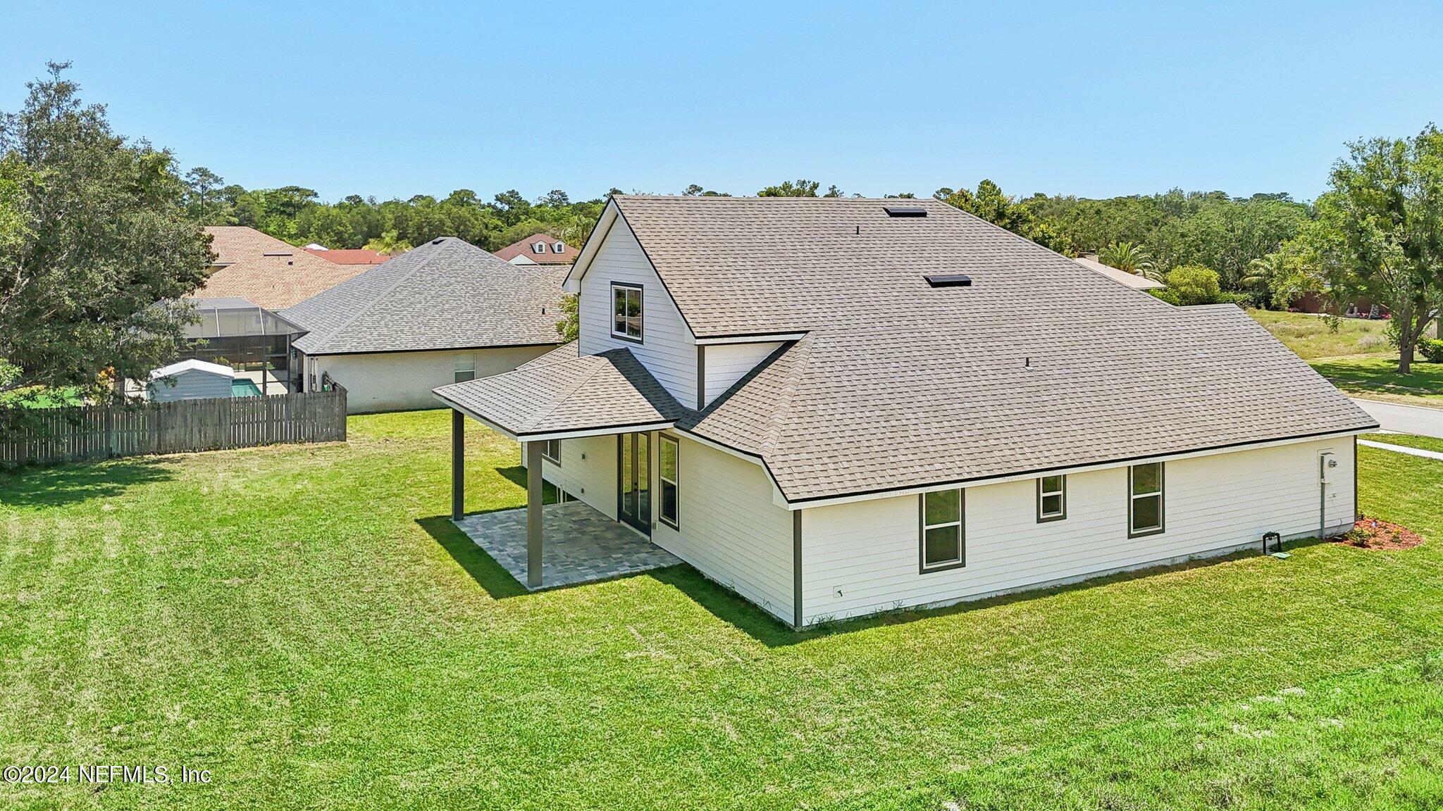 156 Cacique Drive St. Augustine, FL 32086 - Photo 38 of 68 a aerial view of a house with a yard