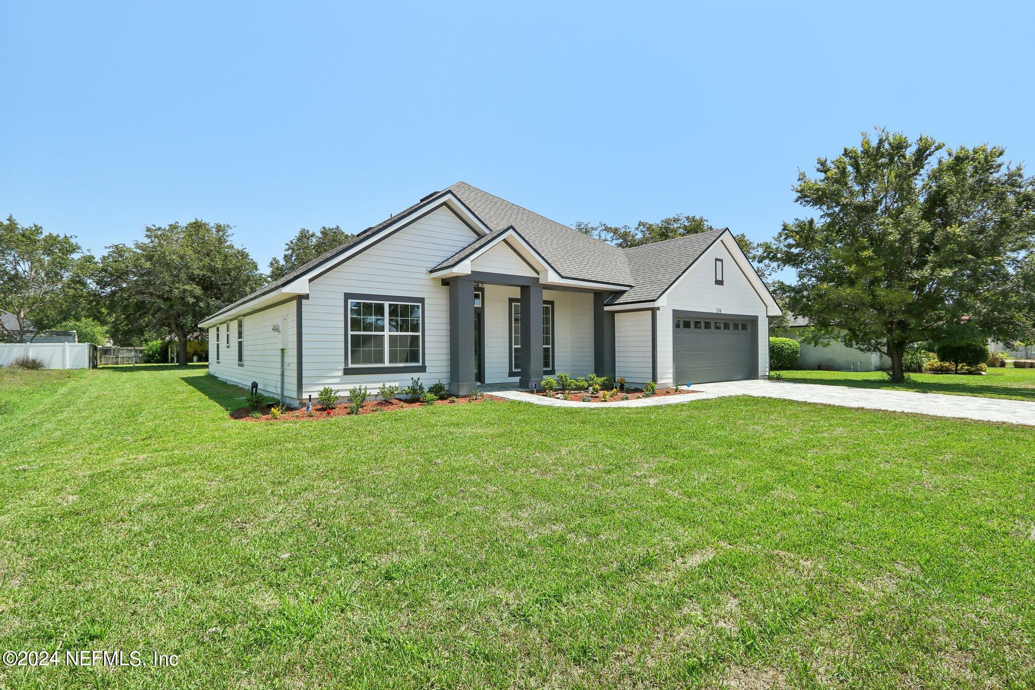 156 Cacique Drive St. Augustine, FL 32086 - Photo 4 of 68 a front view of house with yard and green space