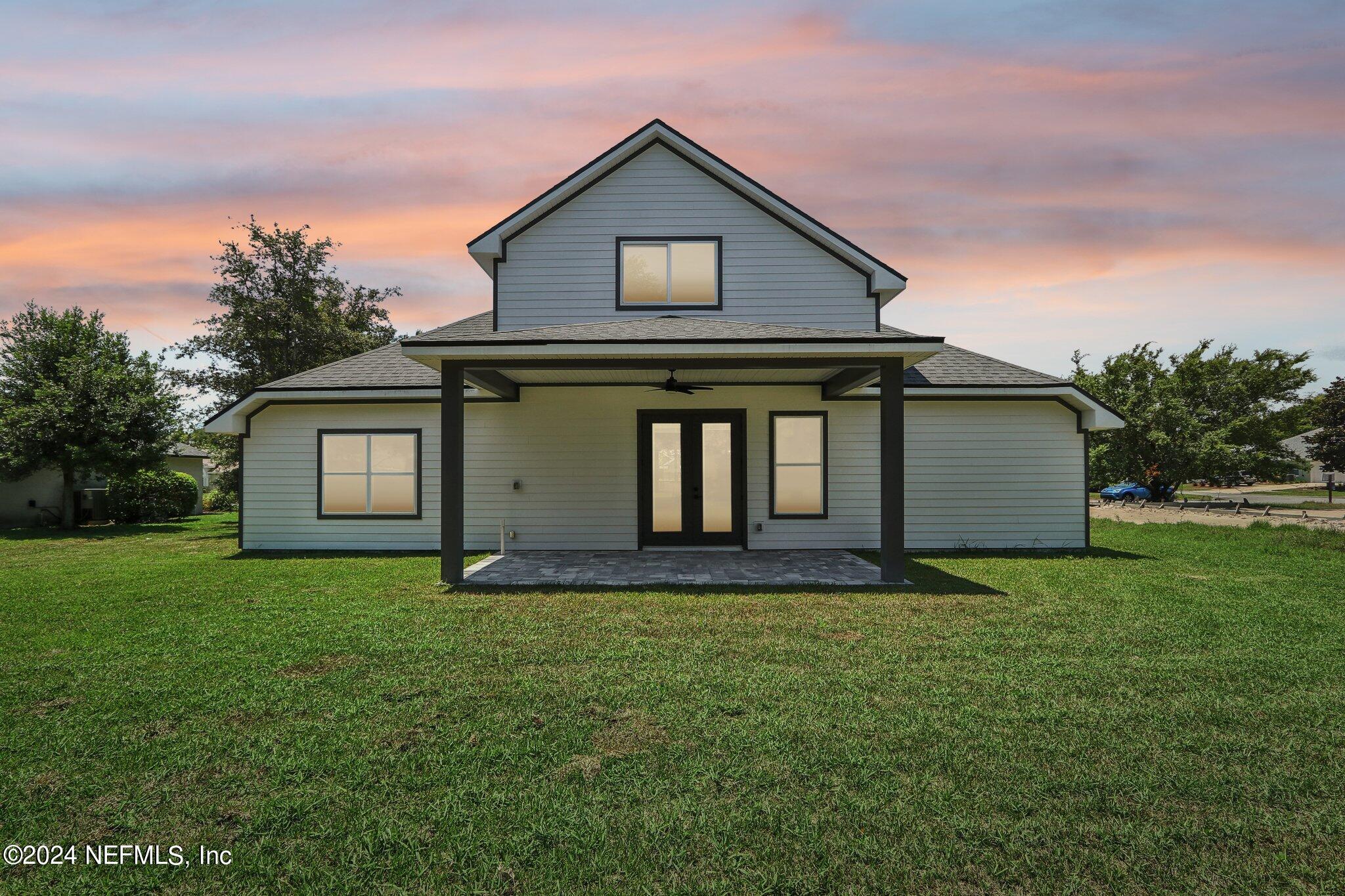156 Cacique Drive St. Augustine, FL 32086 - Photo 43 of 68 a big house with a big yard and more windows