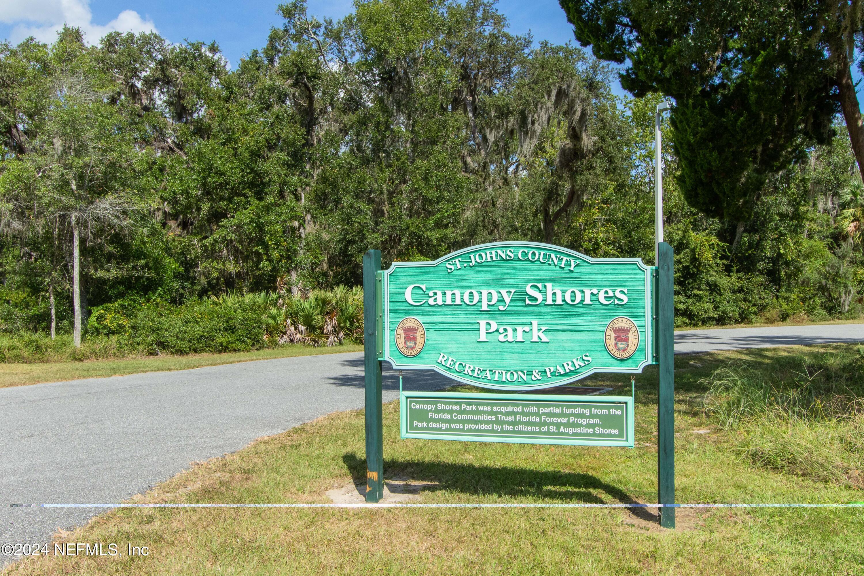 156 Cacique Drive St. Augustine, FL 32086 - Photo 65 of 68 a sign on the side of a road