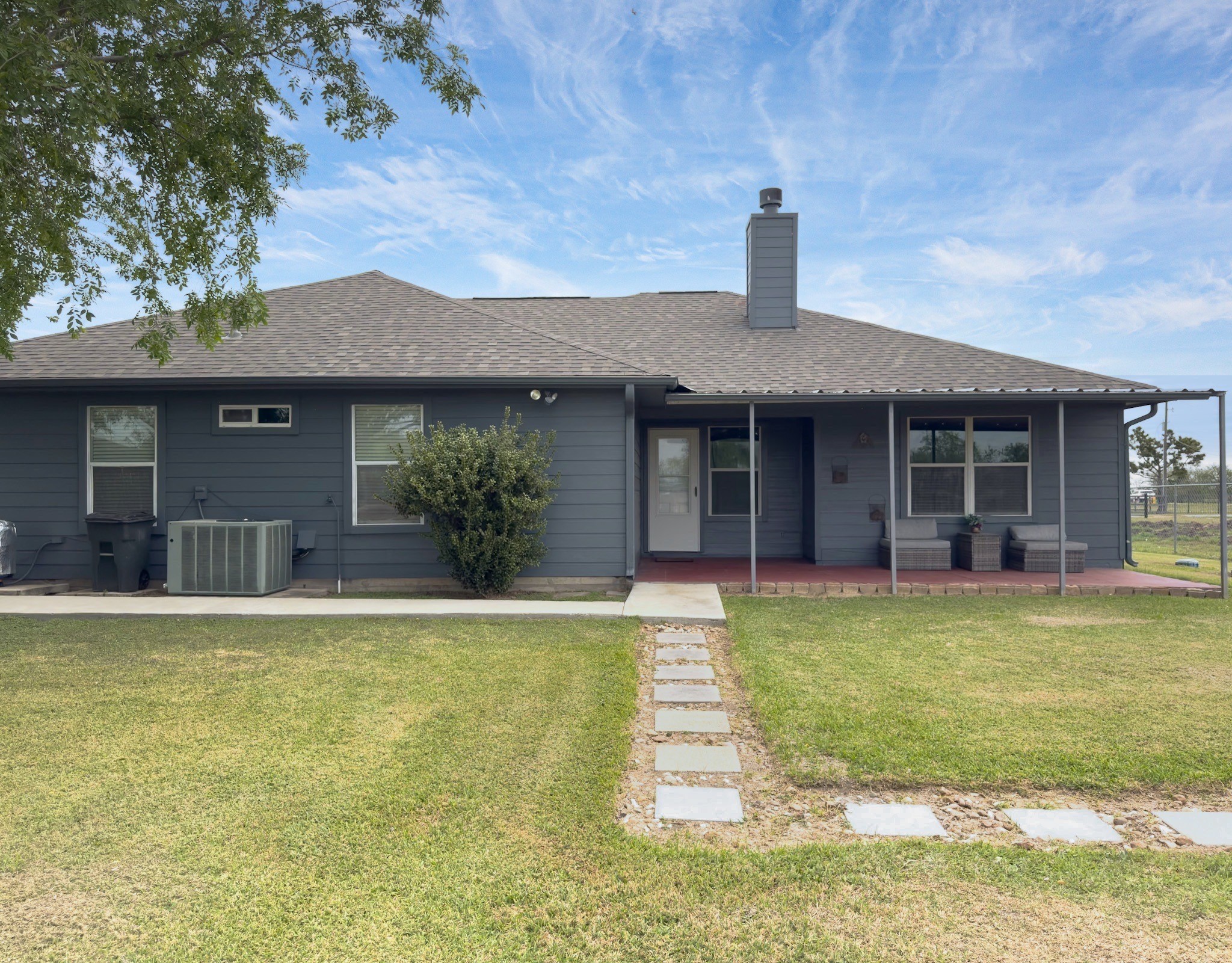 14302 Austin Bayou Drive Rosharon, TX 77583 - Photo 17 of 22 a front view of a house with a yard