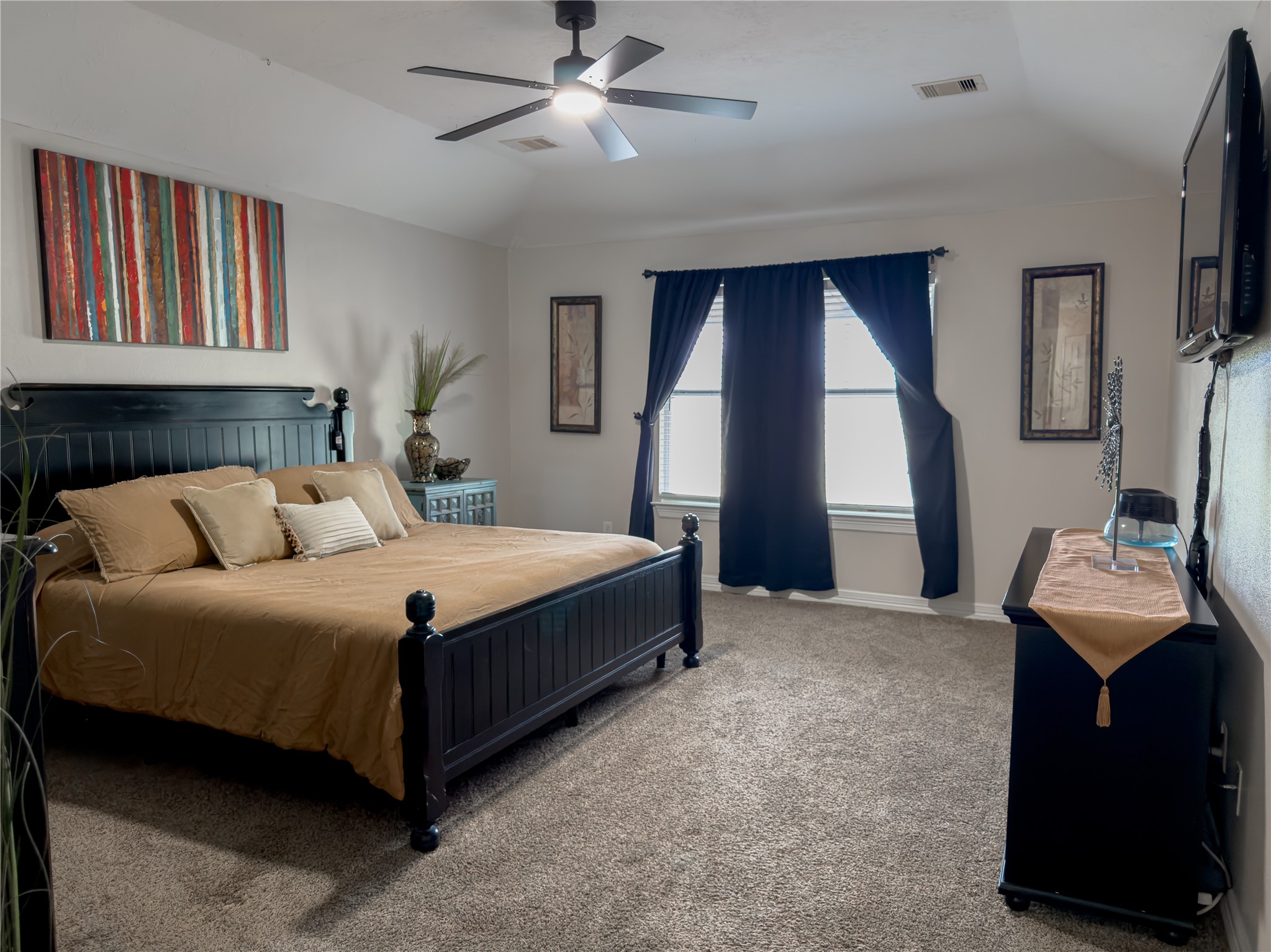 14302 Austin Bayou Drive Rosharon, TX 77583 - Photo 8 of 22 a bedroom with a bed and a flat screen tv