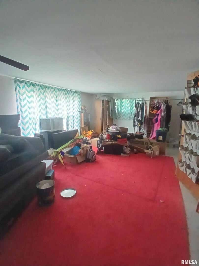 420 South 27th Street Herrin, IL 62948 - Photo 16 of 20 a living room with furniture gym equipment and a large window