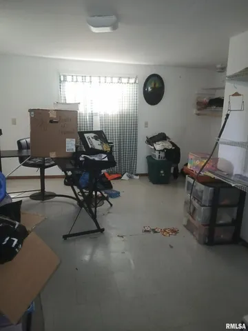 a reading room with furniture and a window