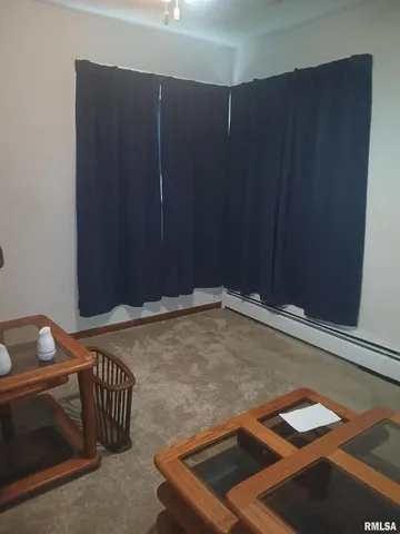 a room with a bed and furniture