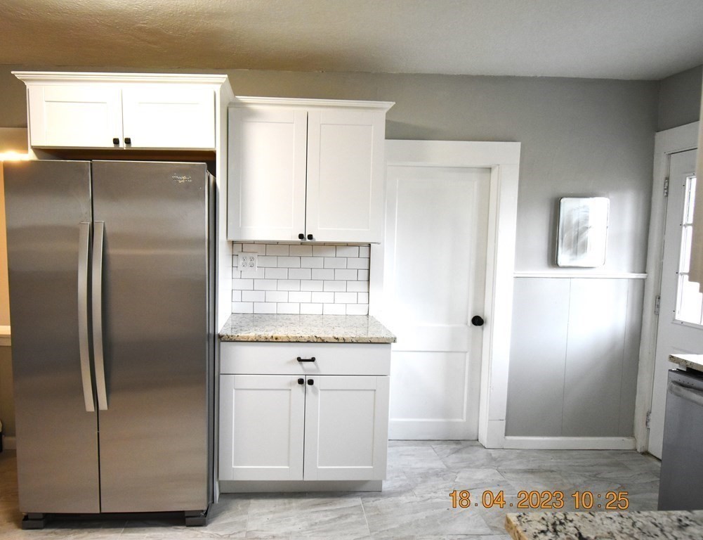 84 Wilton Street Springfield, MA 01109 - Photo 8 of 13 a bathroom with a refrigerator and a sink