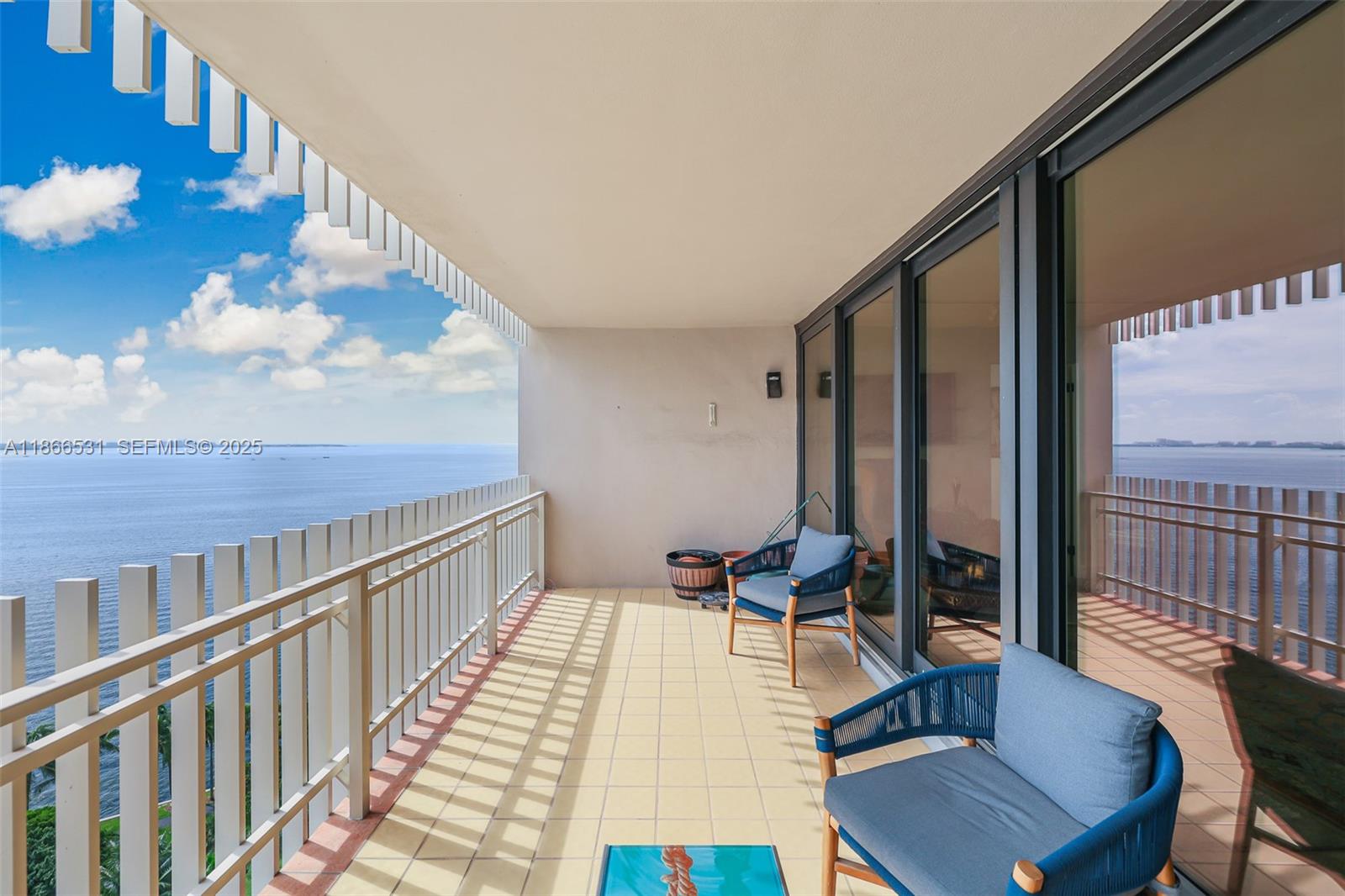 2 Grove Isle Drive, Unit B1603 Miami, FL 33133 - Photo 12 of 20 a view of a living room and balcony with furniture