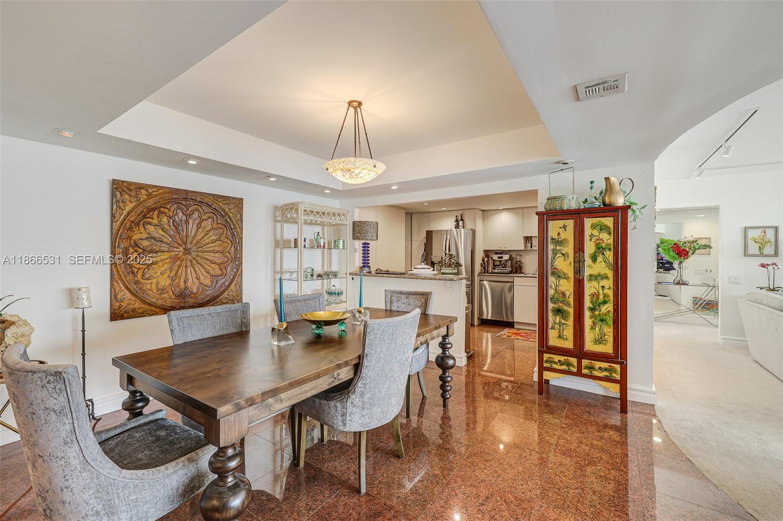 2 Grove Isle Drive, Unit B1603 Miami, FL 33133 - Photo 6 of 20 a view of a dining room with furniture and chandelier