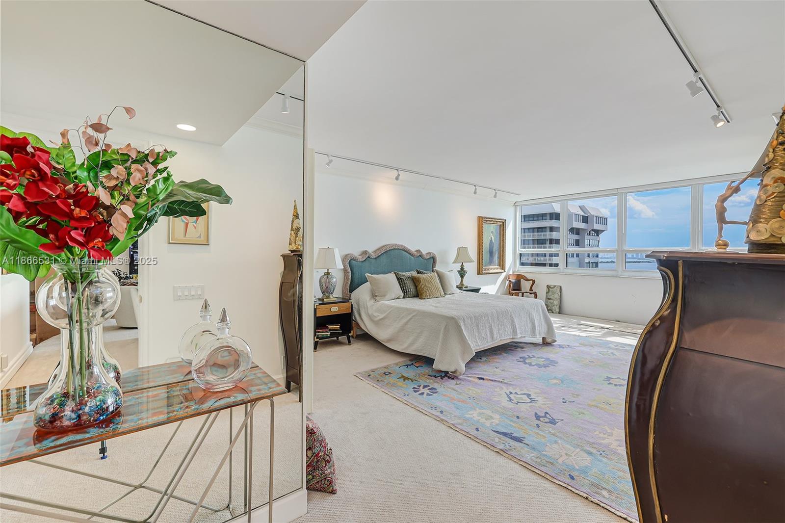 2 Grove Isle Drive, Unit B1603 Miami, FL 33133 - Photo 7 of 20 a bedroom with furniture and a bed