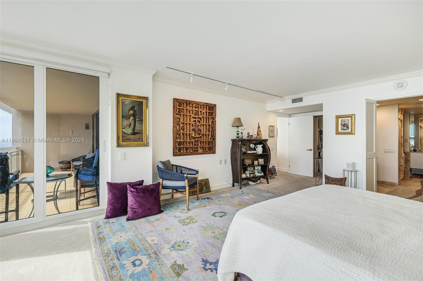 2 Grove Isle Drive, Unit B1603 Miami, FL 33133 - Photo 8 of 20 a bedroom with furniture and large windows