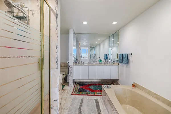 a bed room with a bed and a chair