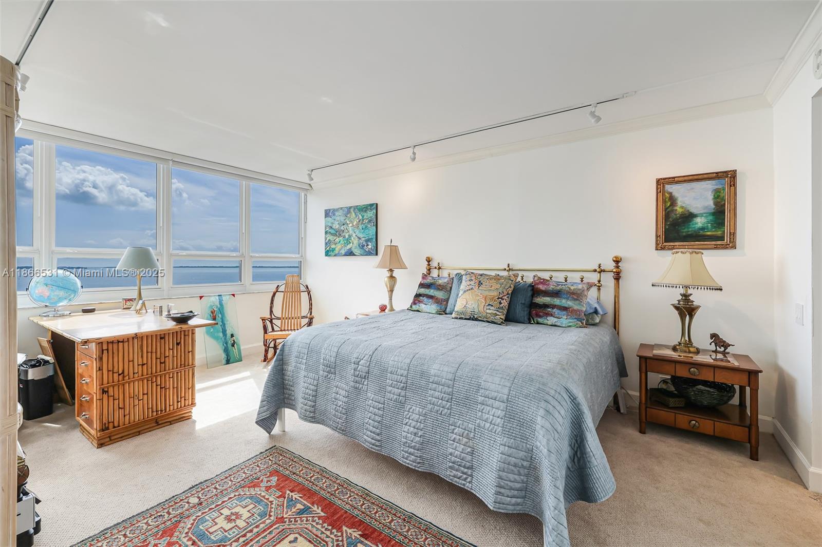 2 Grove Isle Drive, Unit B1603 Miami, FL 33133 - Photo 10 of 20 a bed room with a bed and a chair