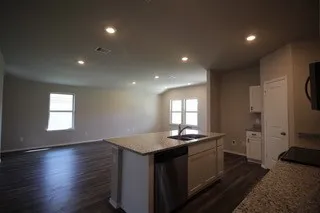 a kitchen with sink and window