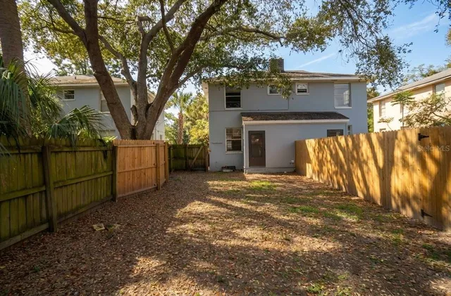 a view of a building with pool and porch
