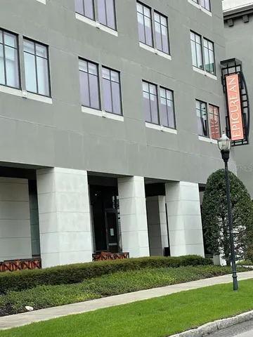 a view of swimming pool with outdoor seating and flowers