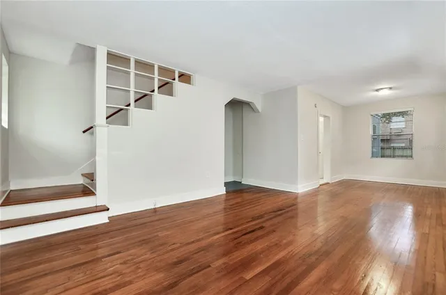 a kitchen with stainless steel appliances and wooden cabinets
