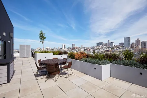 a view of a terrace with sitting area