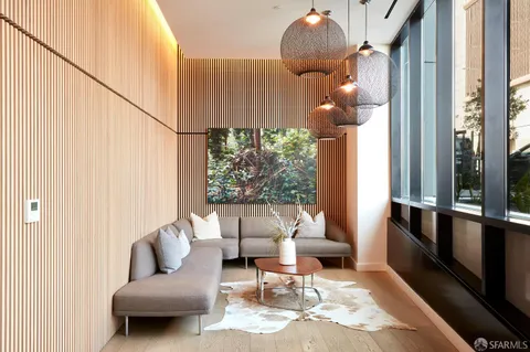 a kitchen with stainless steel appliances granite countertop a refrigerator a sink and a stove