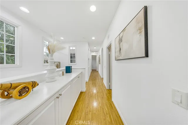 a view of a kitchen with stainless steel appliances granite countertop a sink and cabinets