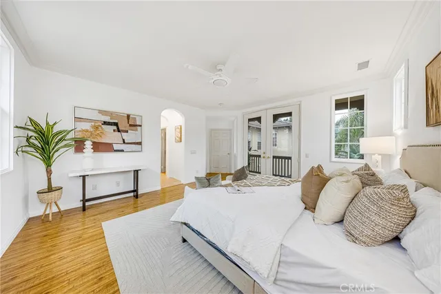 a bedroom with a large bed and a couch