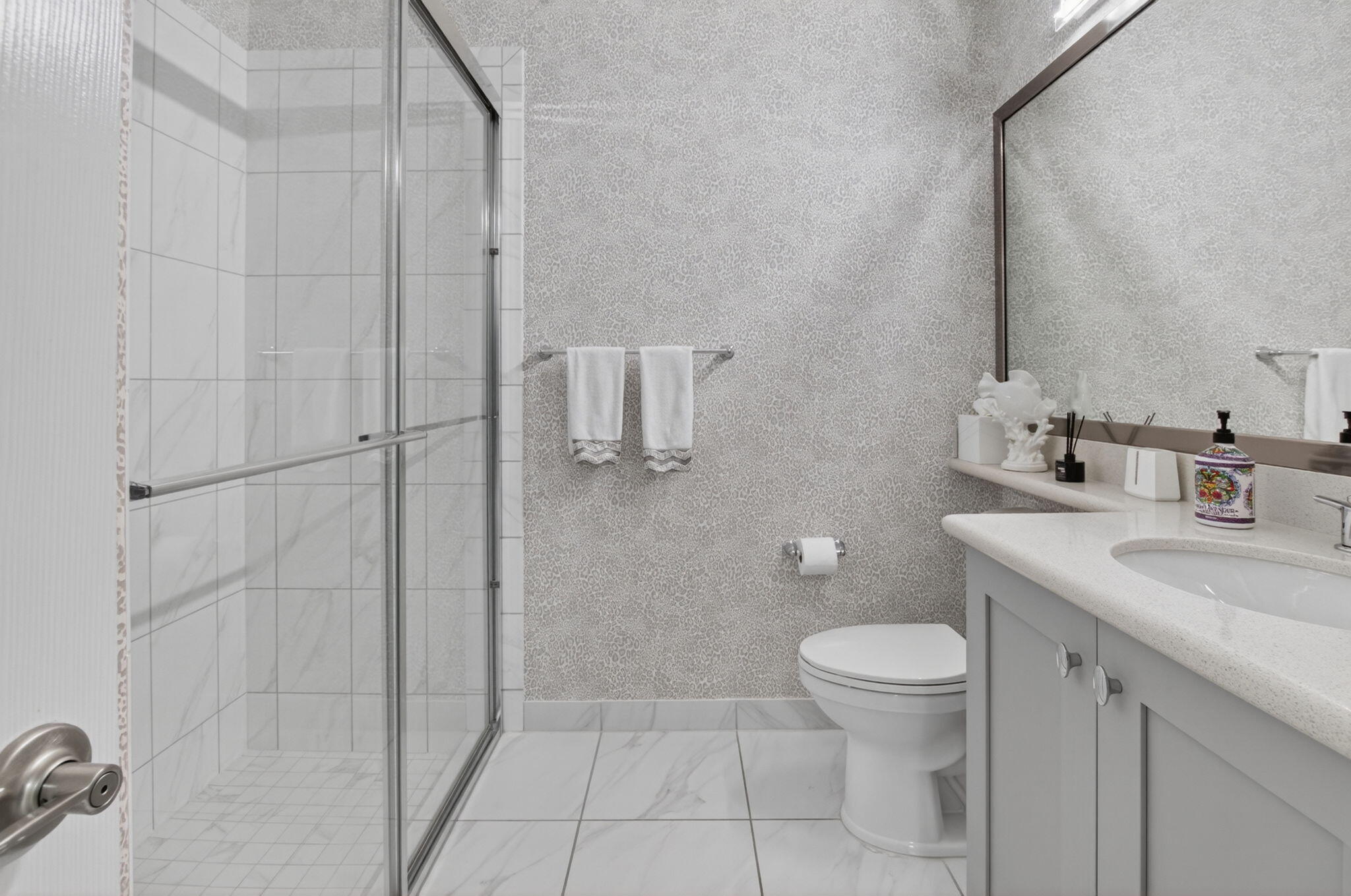 8263 Arabian Range Road Boynton Beach, FL 33473 - Photo 39 of 52 a bathroom with a granite countertop sink a toilet and a mirror