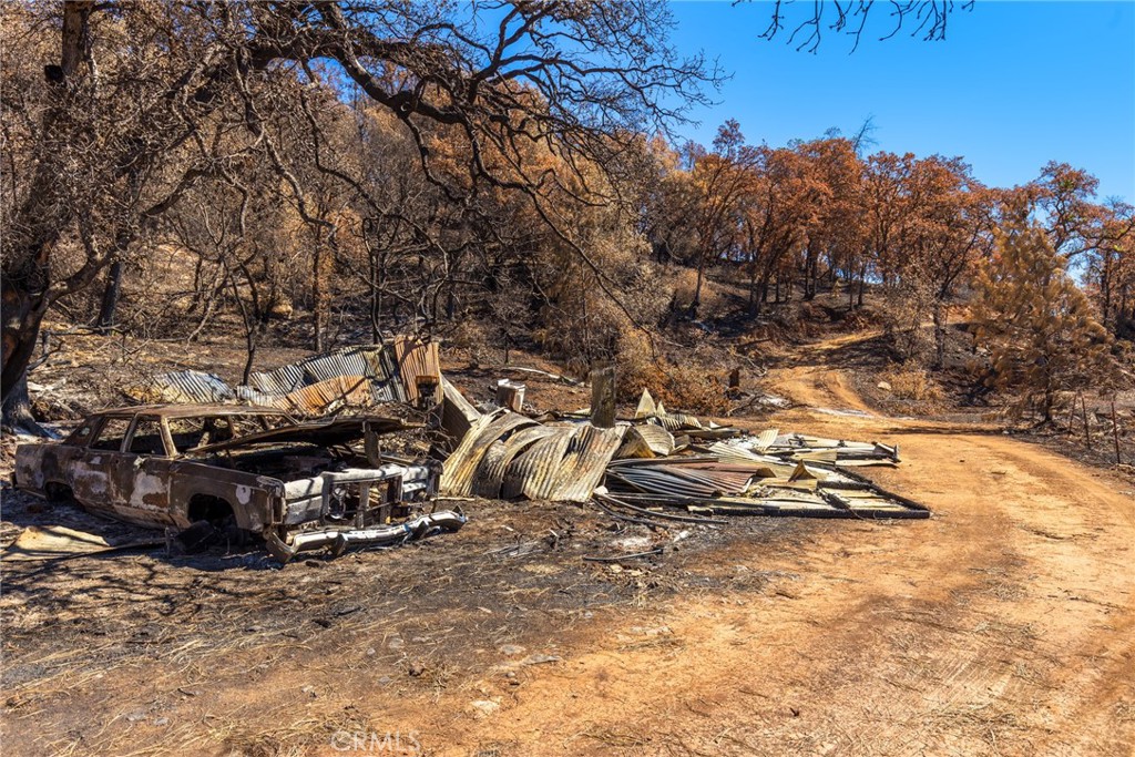 79 Oregon Gulch Road Oroville, CA 95965 - Photo 6 of 16 a view of a backyard with wooden fence