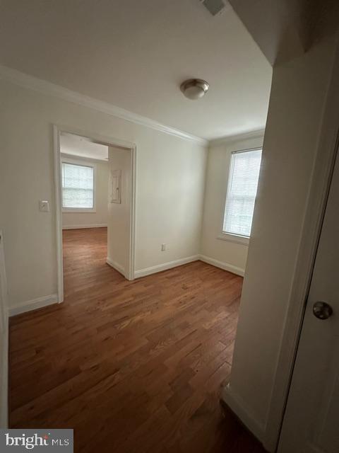 4005 4th Street Southeast, Unit 3 Washington, DC 20032 - Photo 2 of 10 an empty room with wooden floor and windows