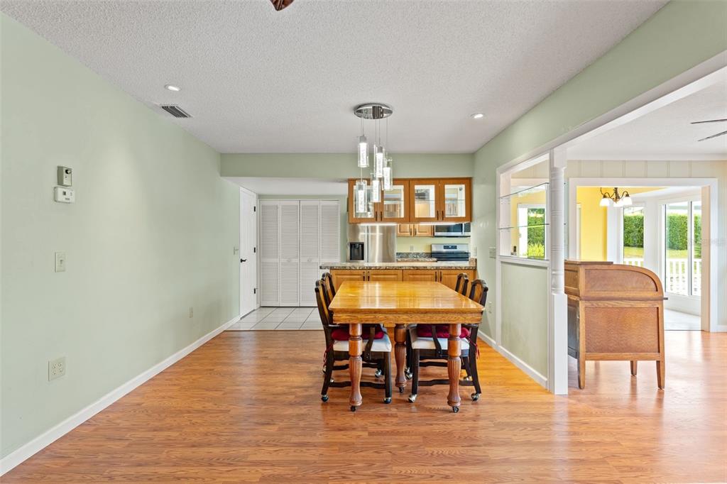 2233 Timber Lodge Lane Spring Hill, FL 34606 - Photo 13 of 59 a dining room with furniture window and wooden floor
