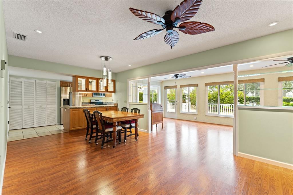 2233 Timber Lodge Lane Spring Hill, FL 34606 - Photo 14 of 59 a view of a dining room with furniture window and wooden floor
