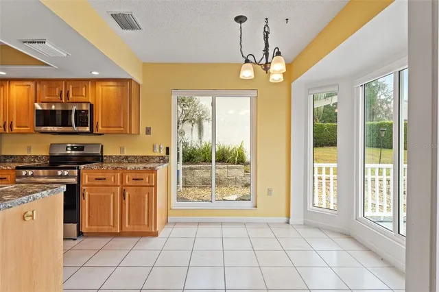 a view of an entryway with wooden floor and door