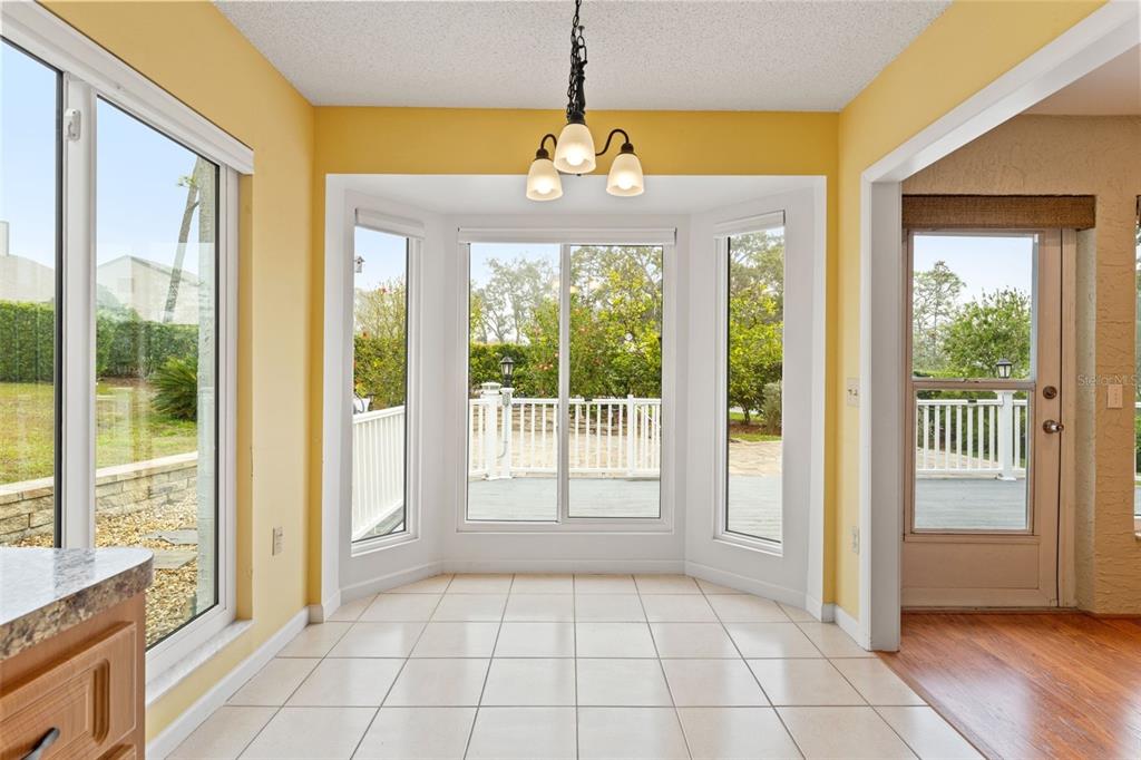 2233 Timber Lodge Lane Spring Hill, FL 34606 - Photo 19 of 59 a view of an entryway with wooden floor and door